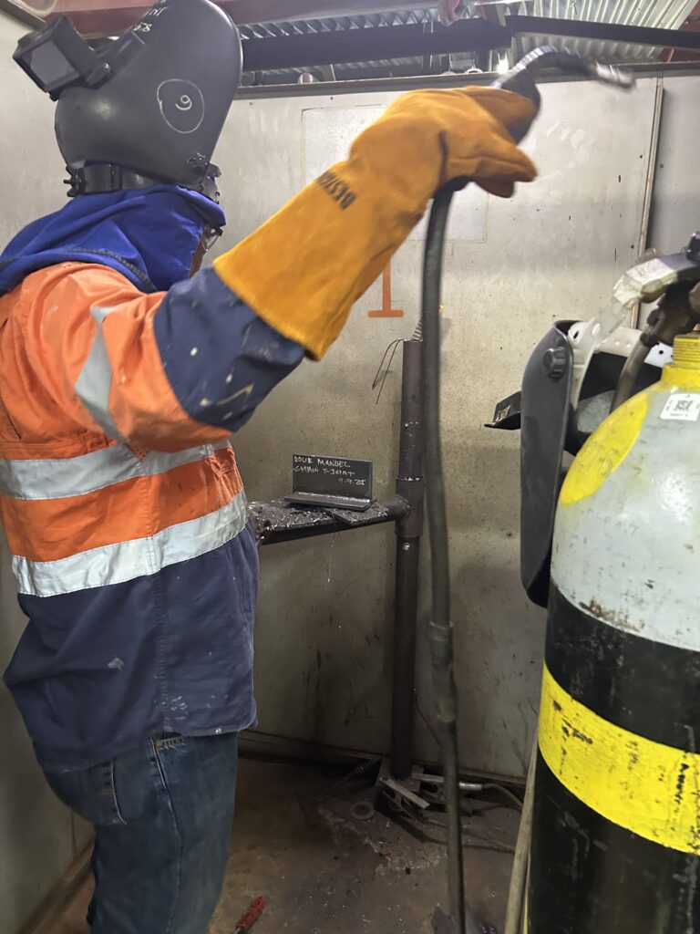 skilled welder doing a trade test in the Philippines